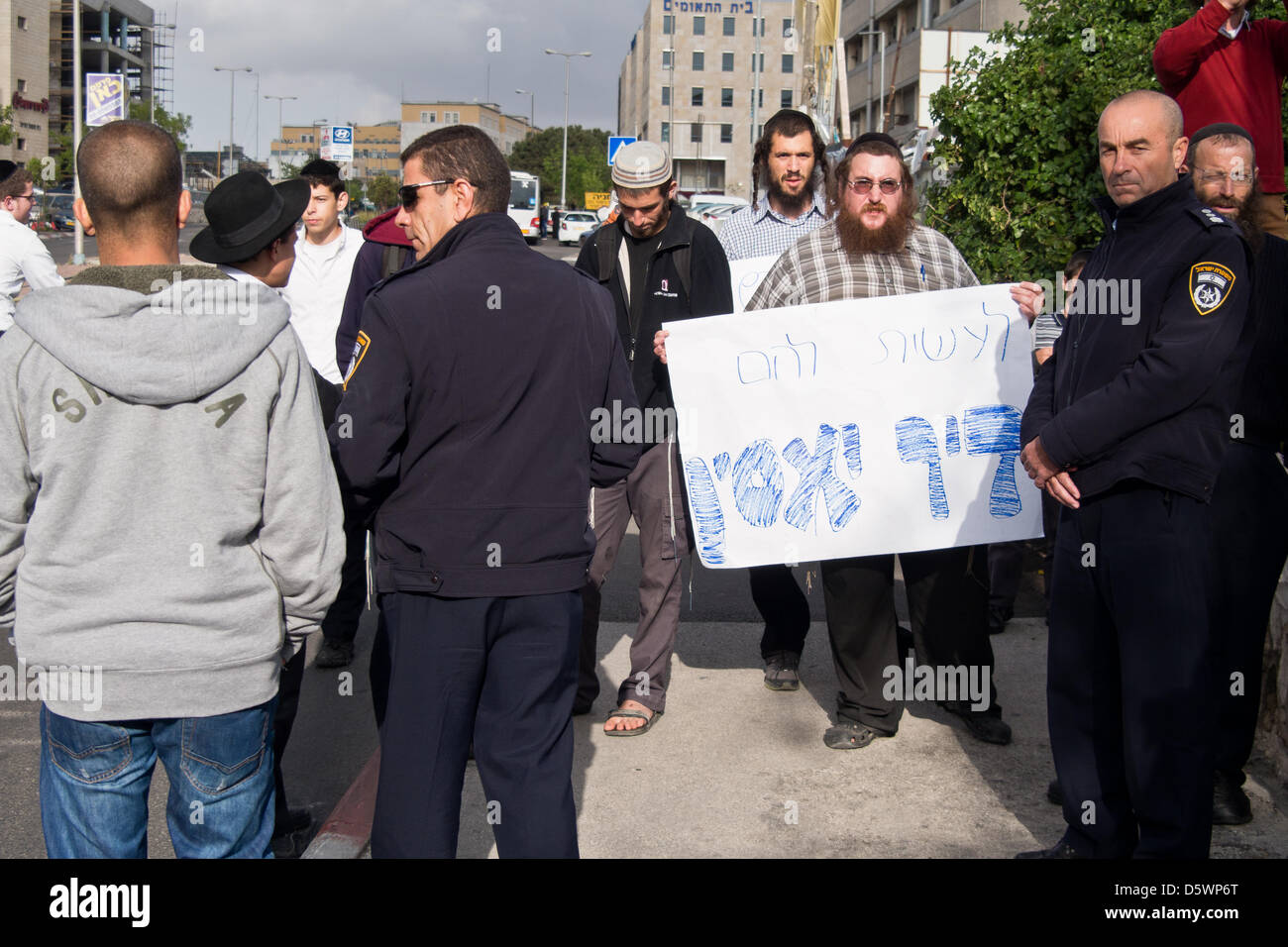 Jerusalem, Israel. 9-Apr-2013. Jewish right-wing activists, lead by Baruch Marzel, disrupt a commemoration procession through the historical village of Deir Yassin, organized by Zochrot (Remembering), seeking to raise public awareness of the Palestinian Nakba (Catastrophe).     Deir Yassin, a pre-1948 Arab village adjacent to Jerusalem with a population of about 600, was invaded by paramilitaries from the Jewish Irgun and Lehi groups on April 9, 1948 and around 115 villagers were massacred. Credit: Nir Alon/Alamy Live News Stock Photo