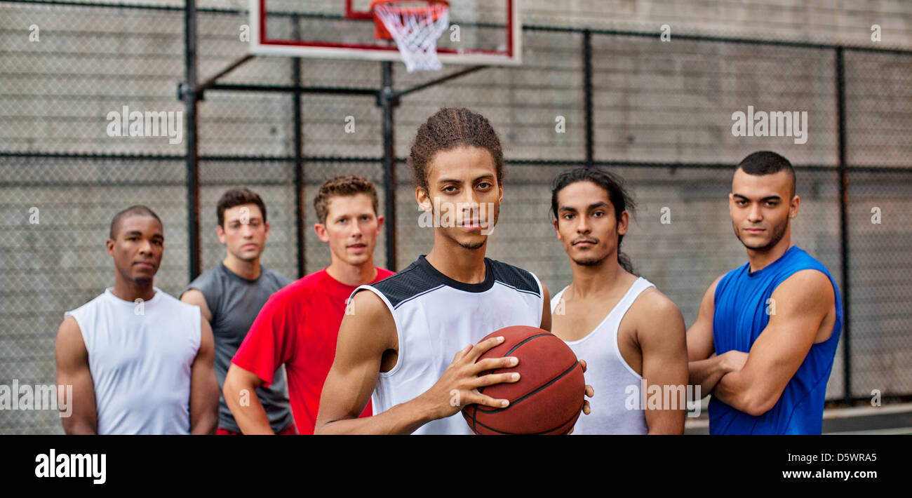 Men standing on basketball court Stock Photo - Alamy