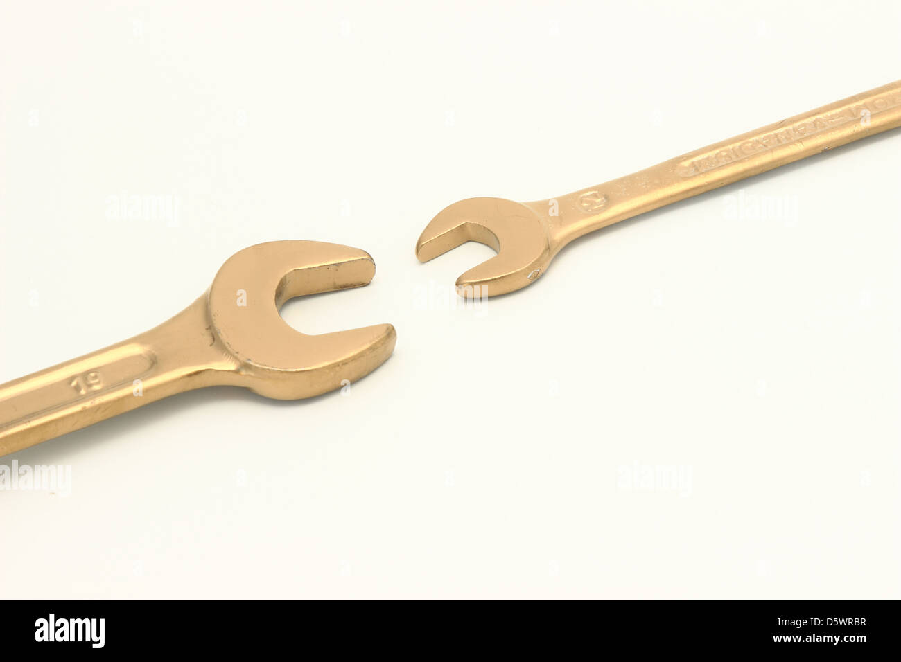 Golden wrench - The cost of labor Stock Photo: 55271547 - Alamy