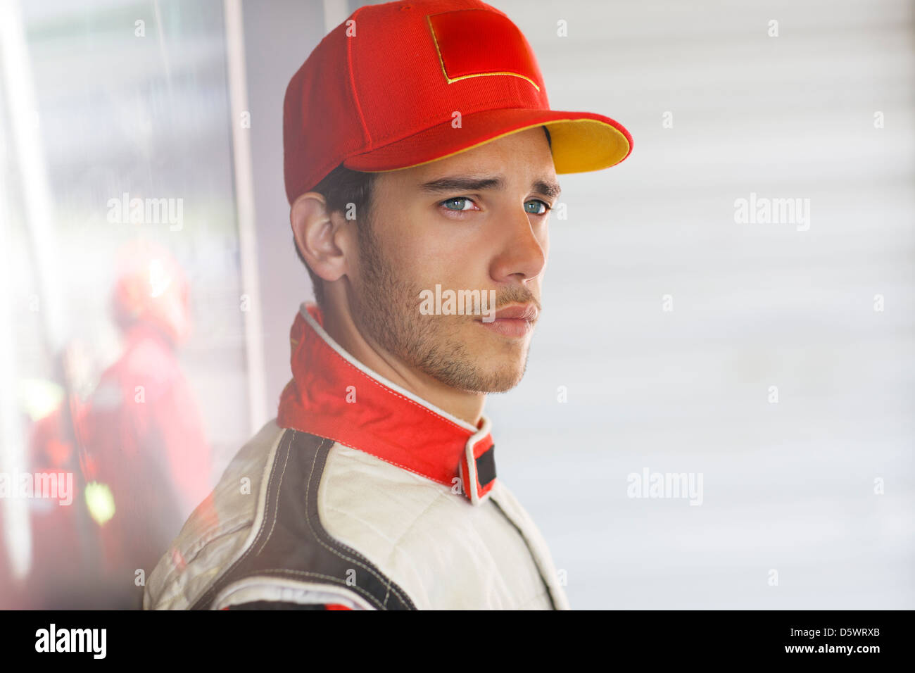 Standing Racer Racer standing in garage Stock Photo - Alamy
