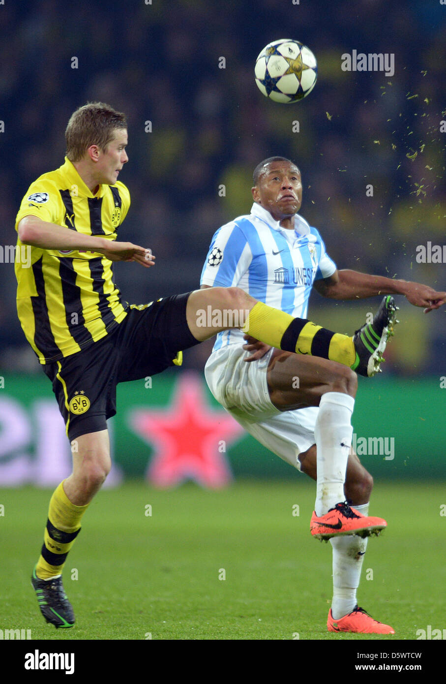 Dortmund, Germany. 9th April 2013. Dortmund's Sven Bender (L) and Malaga's Julio Baptista challenge for the ball during the UEFA Champions League quarter final second leg soccer match between Borussia Dortmund and Malaga CF at BVB stadium Dortmund in Dortmund, Germany. Credit: Action Plus Sports Images /Alamy Live News Stock Photo