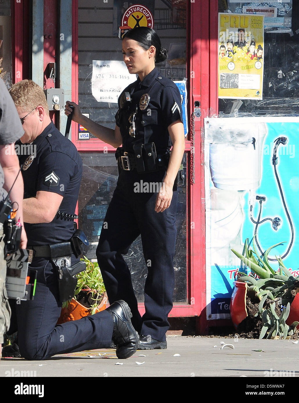Lucy Liu dresses as a police officer on the set of the television show ' Southland' Los Angeles, California - 08.02.12 Stock Photo - Alamy