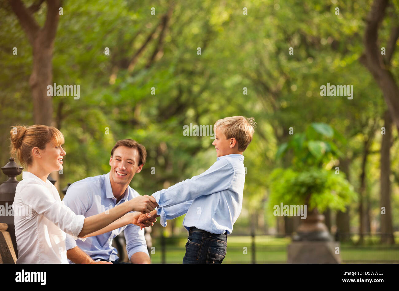 Family playing together in park Stock Photo - Alamy