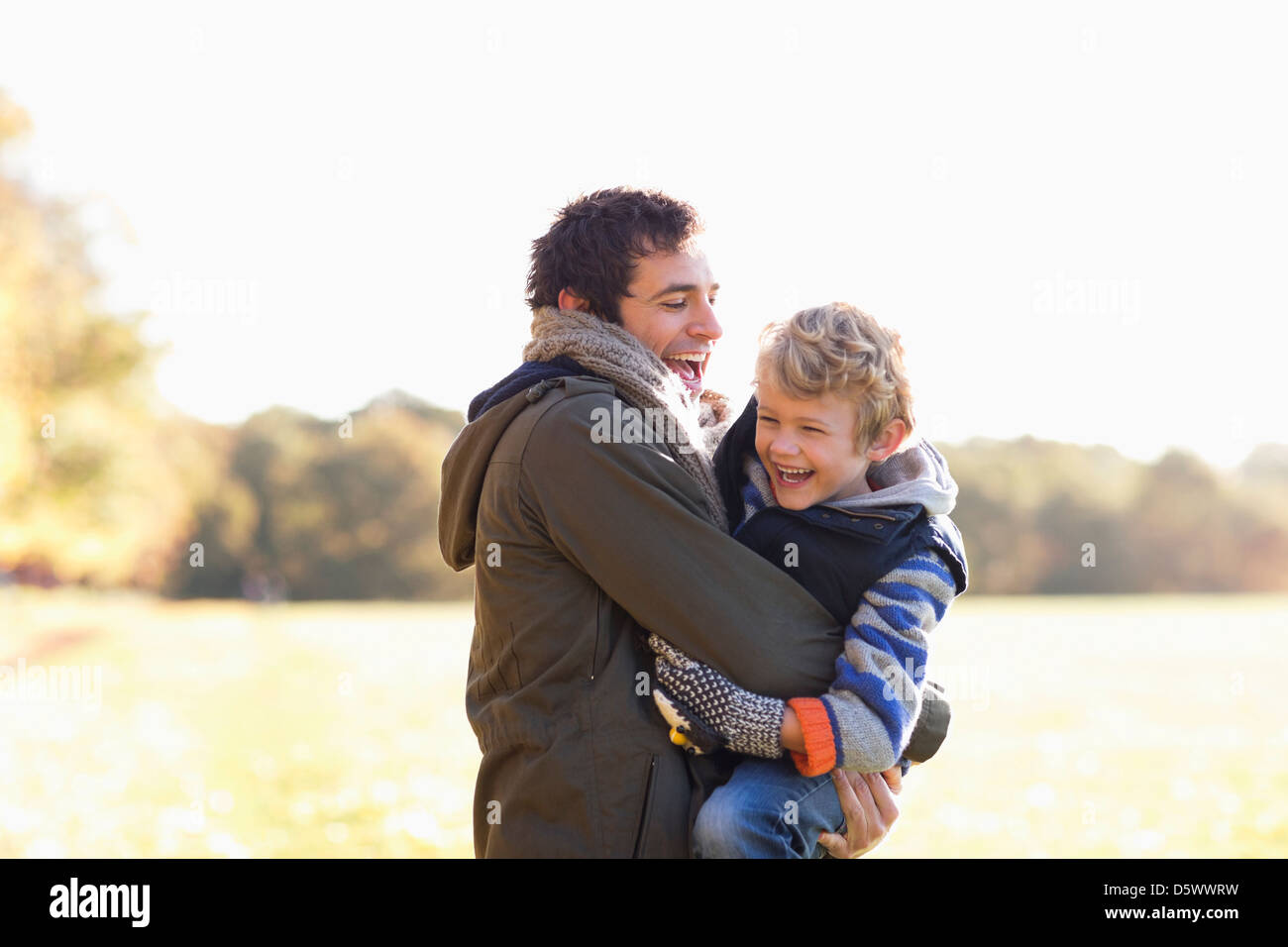 Father and son playing outdoors Stock Photo