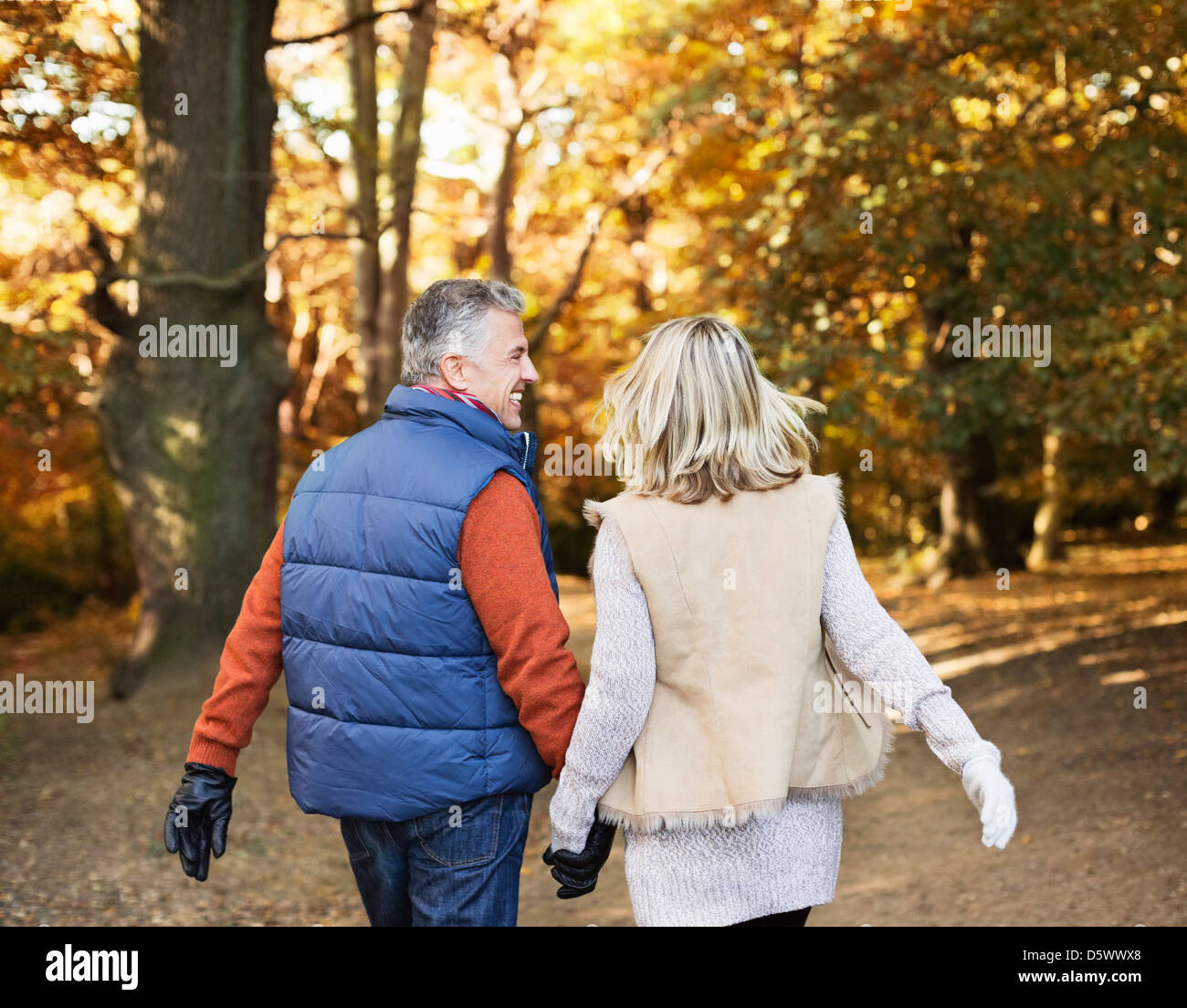 Older couple walking together in park Stock Photo - Alamy