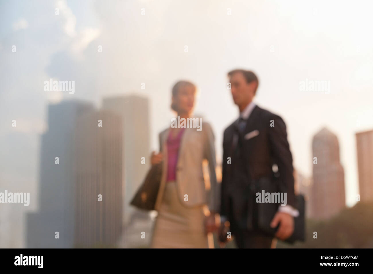 Business people walking in urban park Stock Photo - Alamy