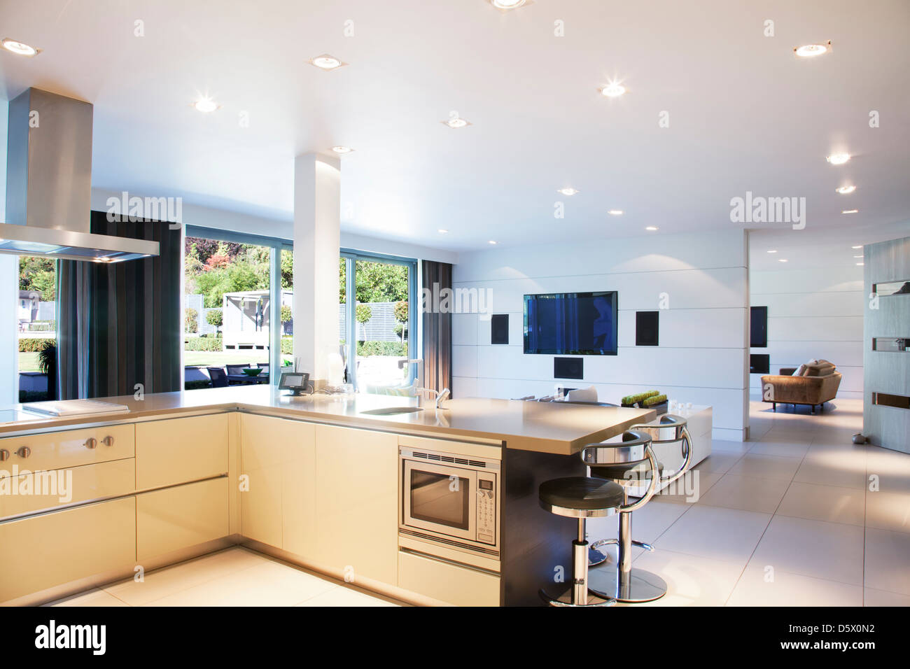 Kitchen and living room in modern home Stock Photo - Alamy