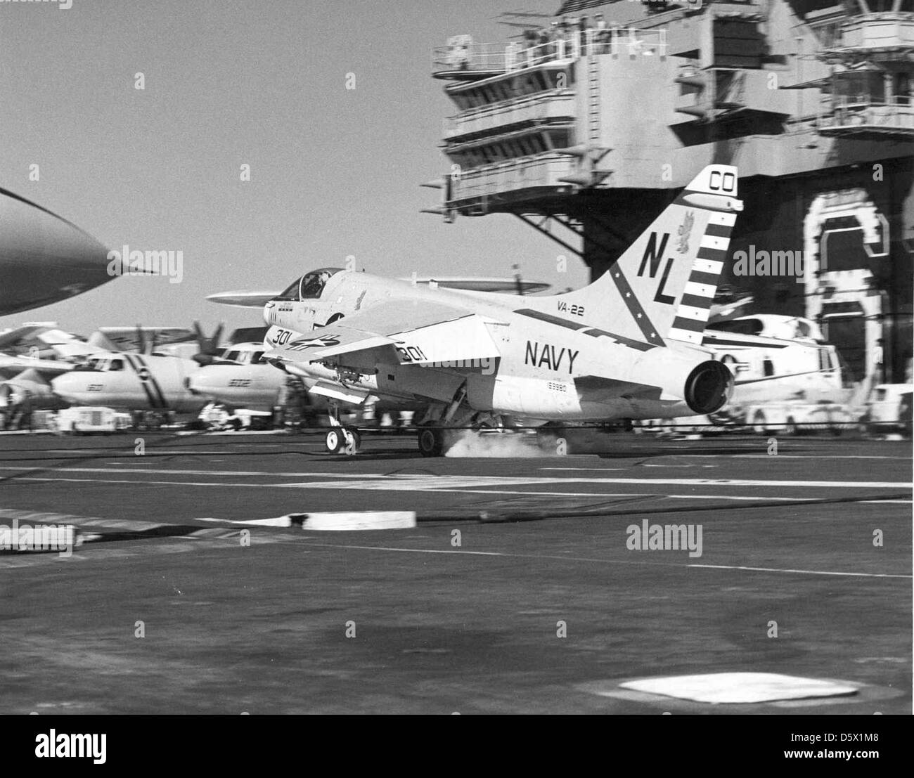 LTV A-7E 'Corsair II' of VA-22 having completed an arrested landing on the flight deck of the USS KITTY HAWK (CV-63). Stock Photo