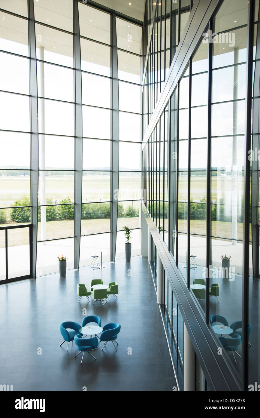 Chairs and tables in office lobby area Stock Photo Alamy