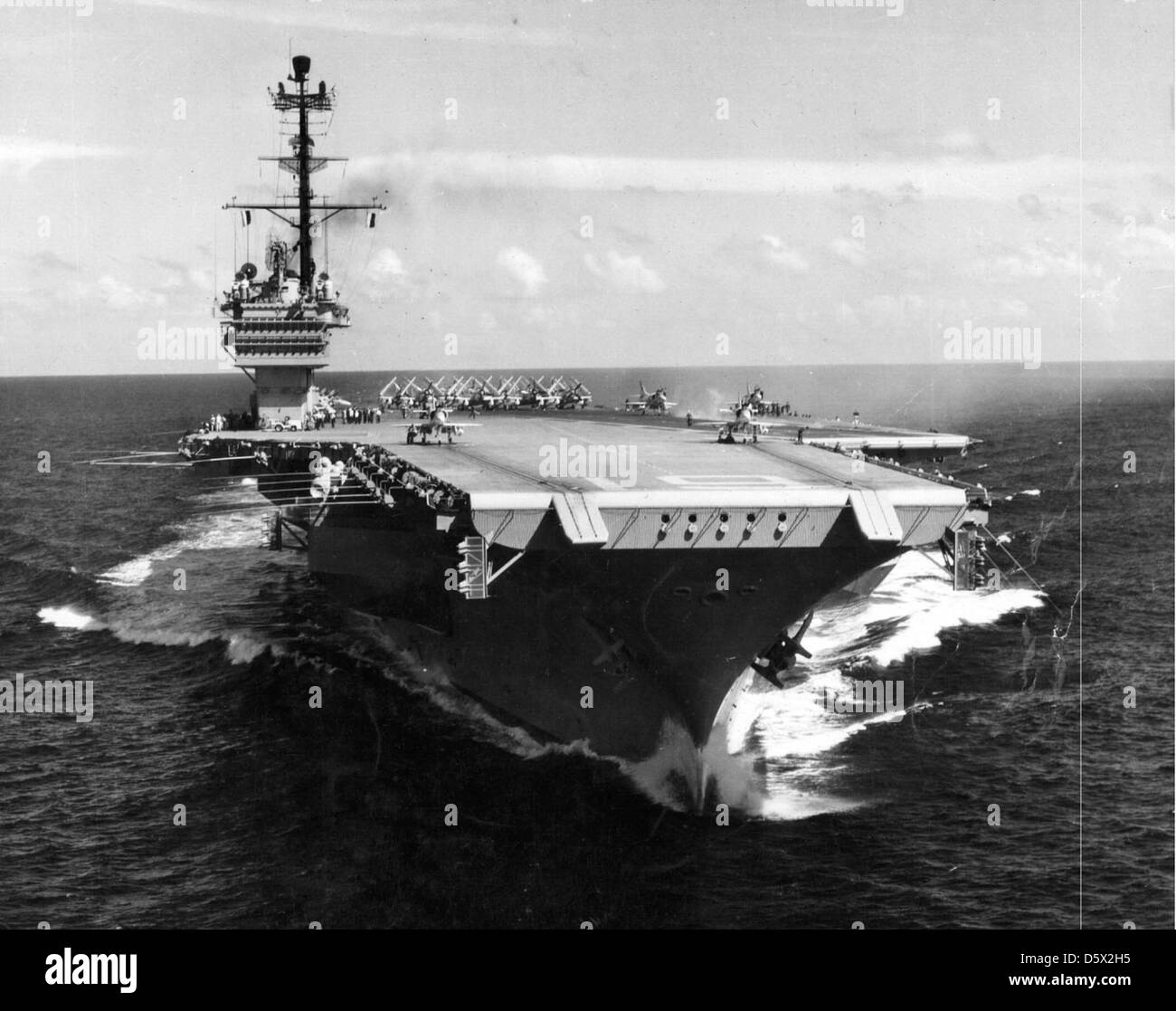 USS RANGER (CVA-61) pictured with a Douglas A4D 'Skyhawk' and Douglas AD 'Skyraider' on the flight deck. Stock Photo