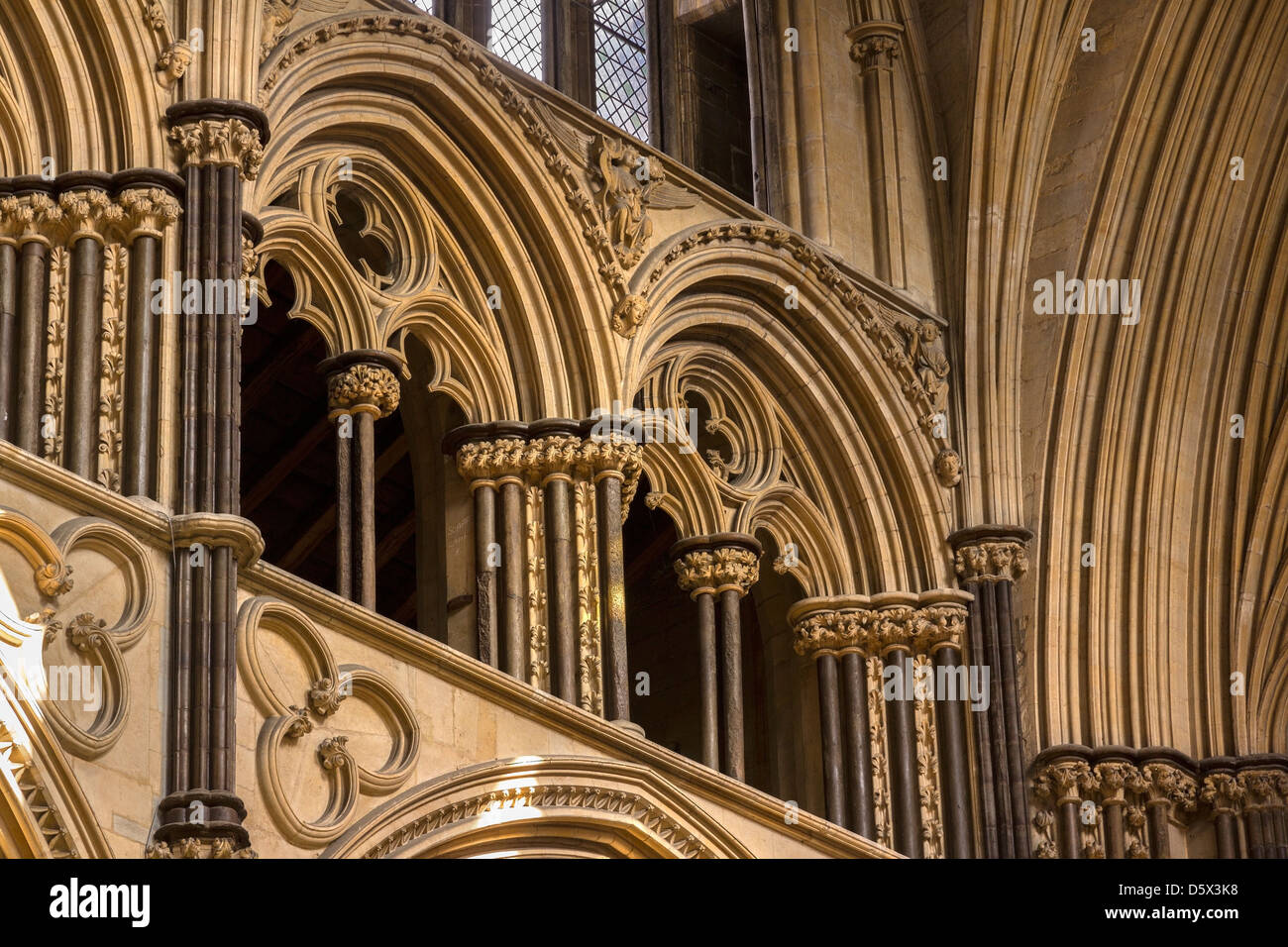 Pointed Gothic stone masonry arches in Angel Choir of Lincoln Cathedral, Lincolnshire, England, UK Stock Photo