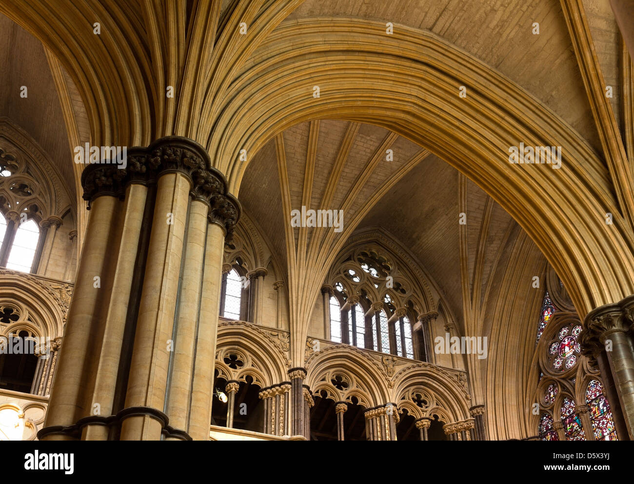 Pointed Gothic masonry arches, stone pillars and vaulted ceilings, Lincoln Cathedral, Lincolnshire, England, UK Stock Photo