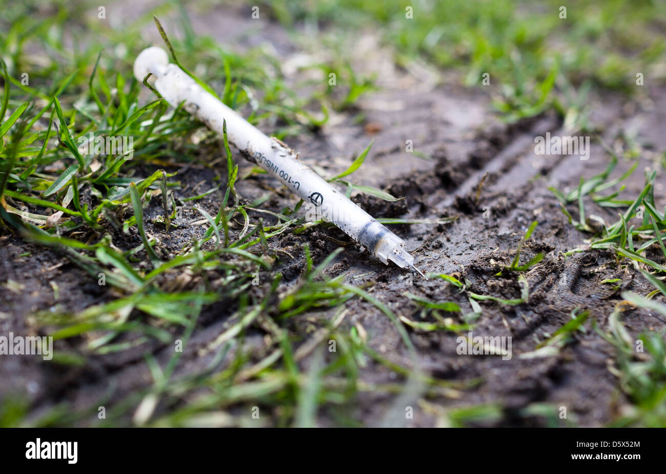 A discarded used Heroin Needle. Stock Photo