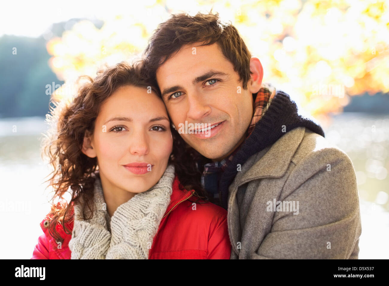 Couple hugging in park Stock Photo - Alamy