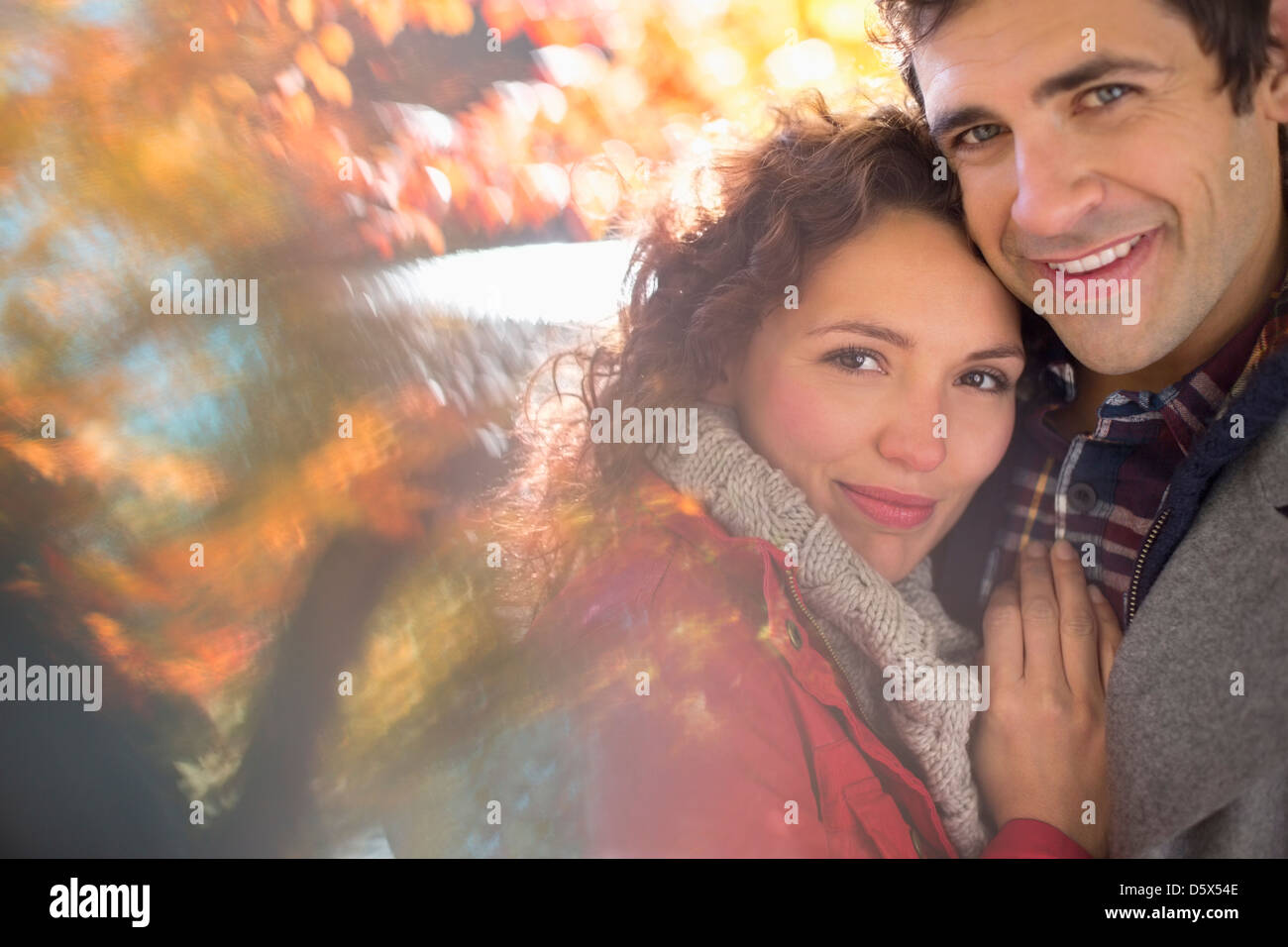 Couple hugging in park Stock Photo - Alamy
