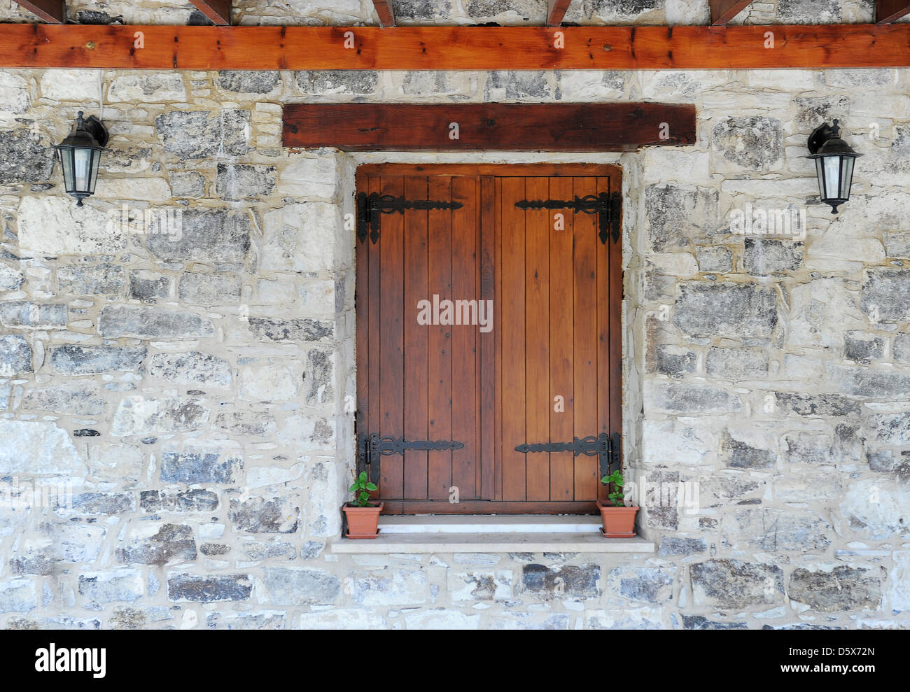 Wooden window in the stone wall Stock Photo - Alamy