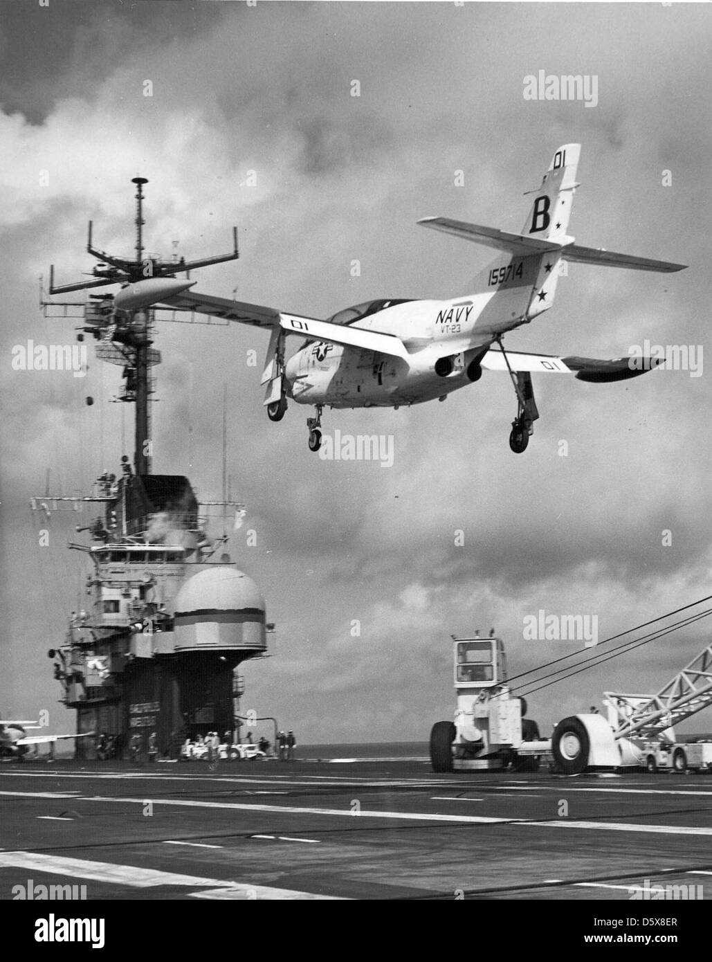 A North American T-2C 'Buckeye' of Training Squadron (VT) 23 takes a waver during flight operations on board the USS LEXINGTON (AVT-16). Stock Photo