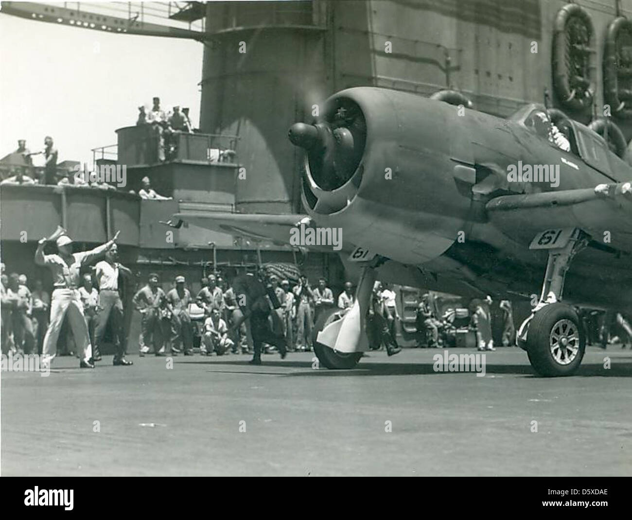 A Grumman F6F 'Hellcat' of FS (VF) 12 prepares to launch from the USS SARATOGA (CV-3) during 1943-1944. Stock Photo