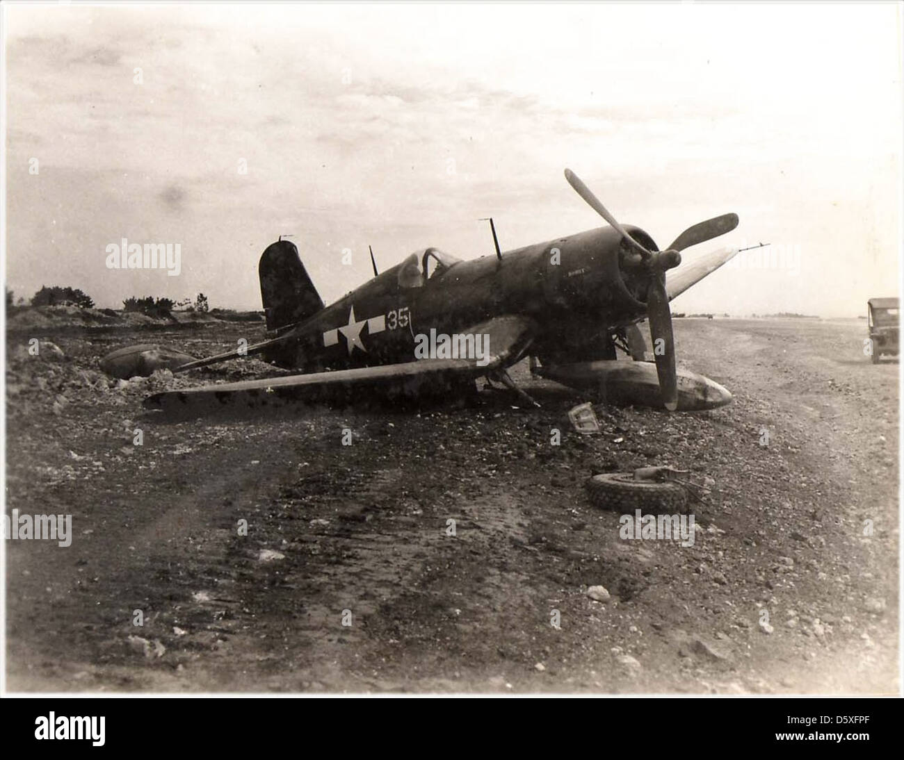 Battle-damaged Vought F4U 'Corsair', probably pictured on Ie Shima, 1945. Stock Photo