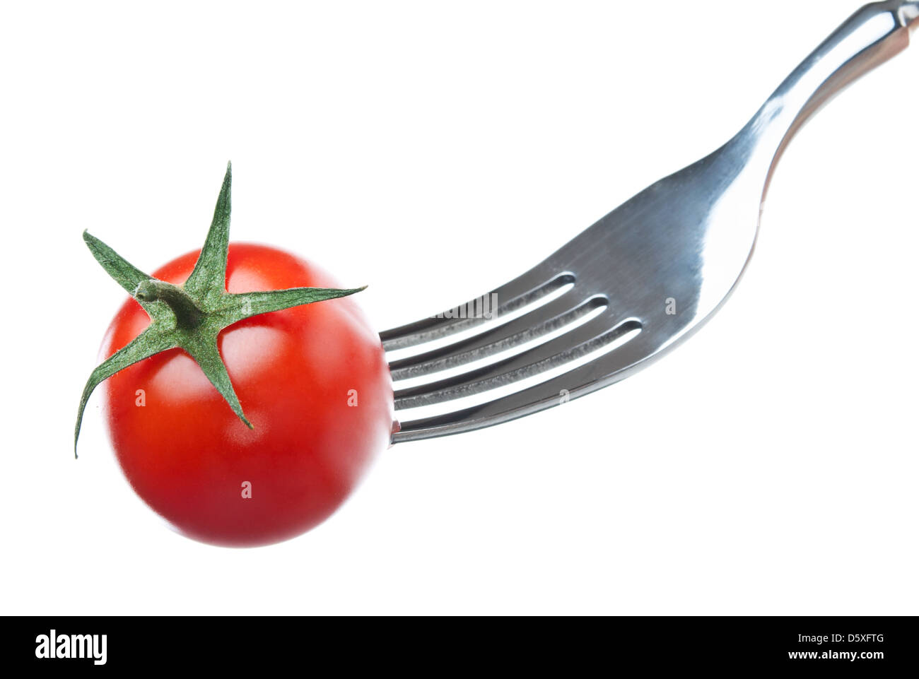 One Cherry Tomato On A Fork Over White Background Stock Photo Alamy