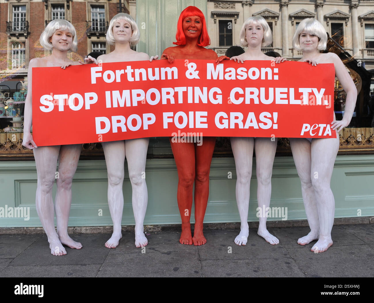 Atmosphere PETA activists protest against the sale of foie gras at Fortnum & Mason The demonstrators are painted red and white Stock Photo