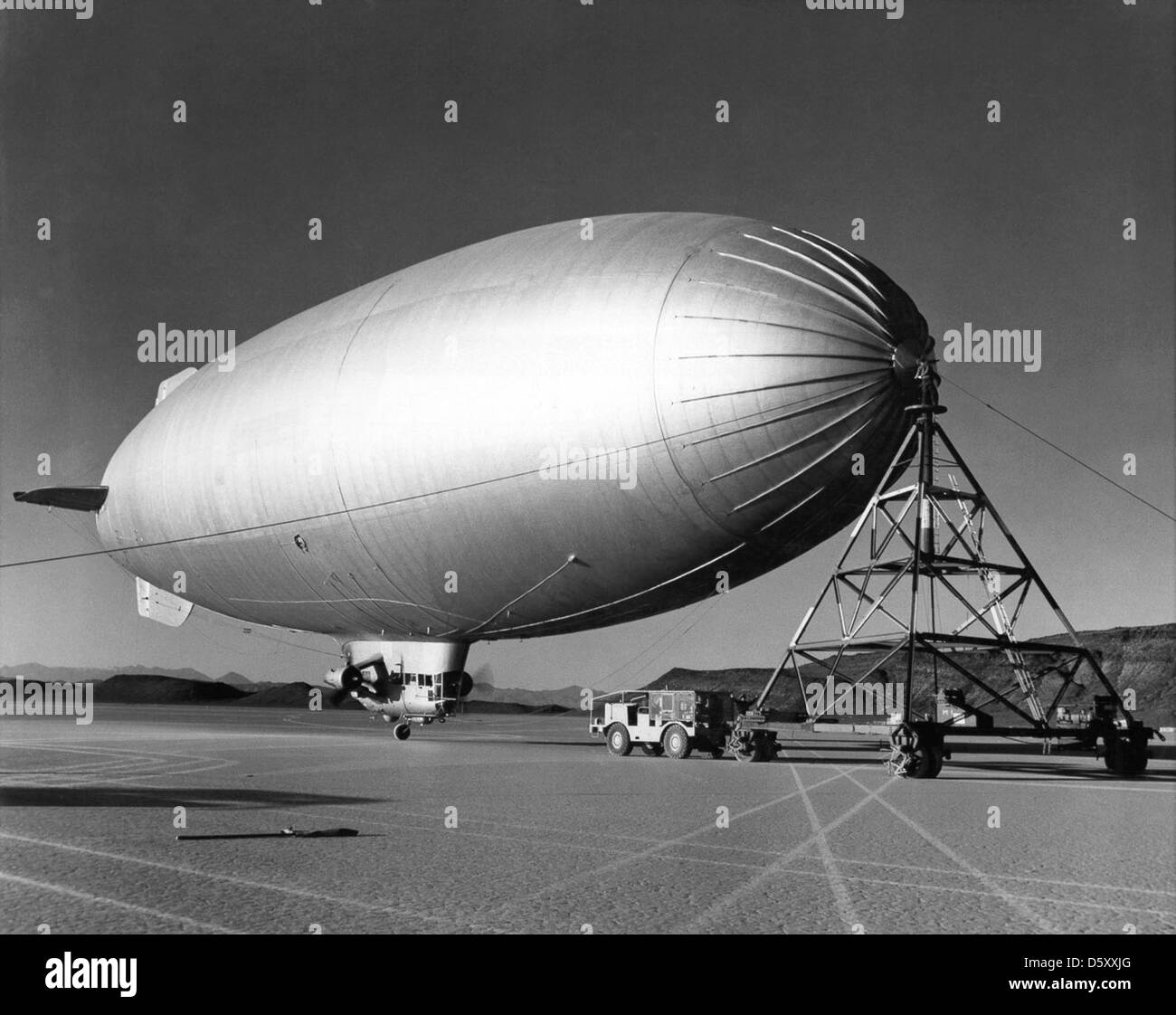 July 24, 1957 - Navy ZSC-1 Blimp ties up at mooring platform in Yucca Flat, having just arrived from Lakehurst NAS to prepare for Atomic blast tests. Stock Photo