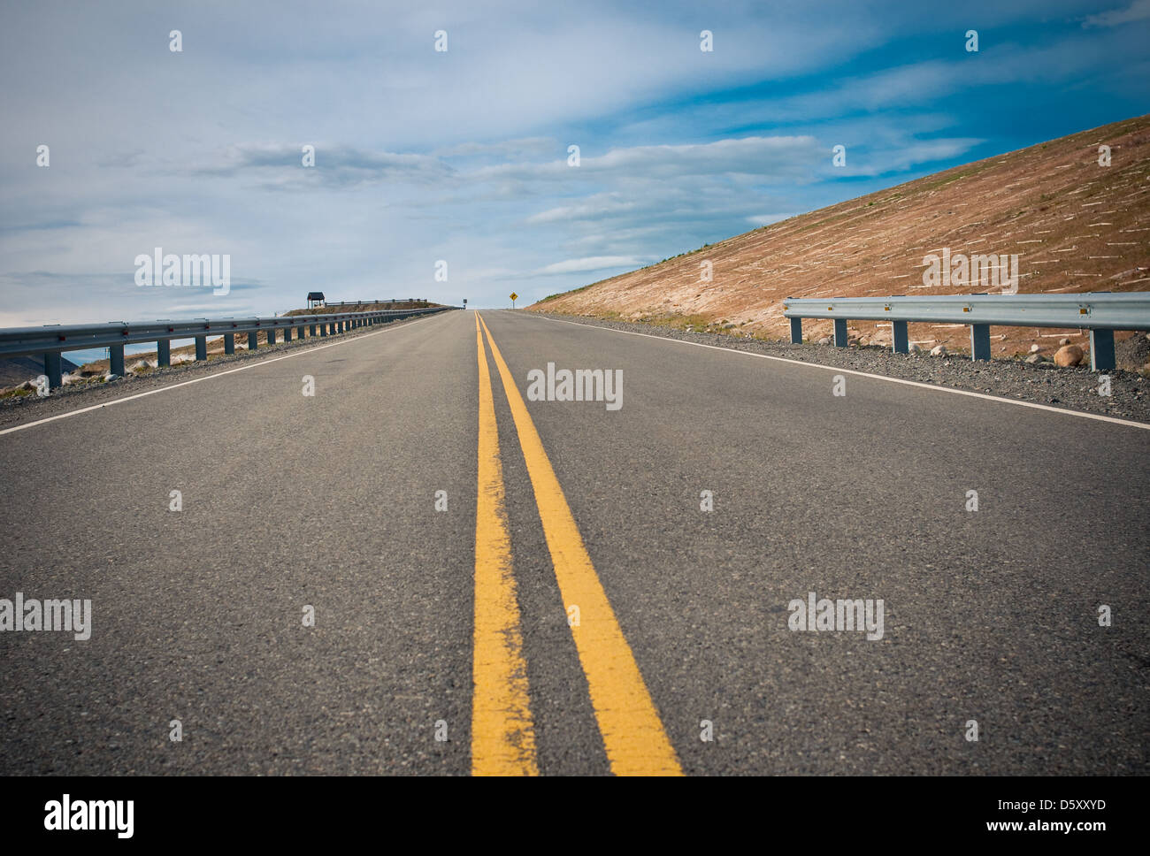 vibrant image of highway and blue sky Stock Photo - Alamy