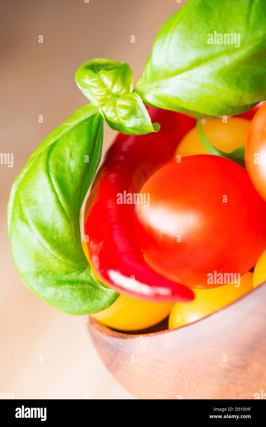 basil leafs with cherry tomatoes and pepper Stock Photo