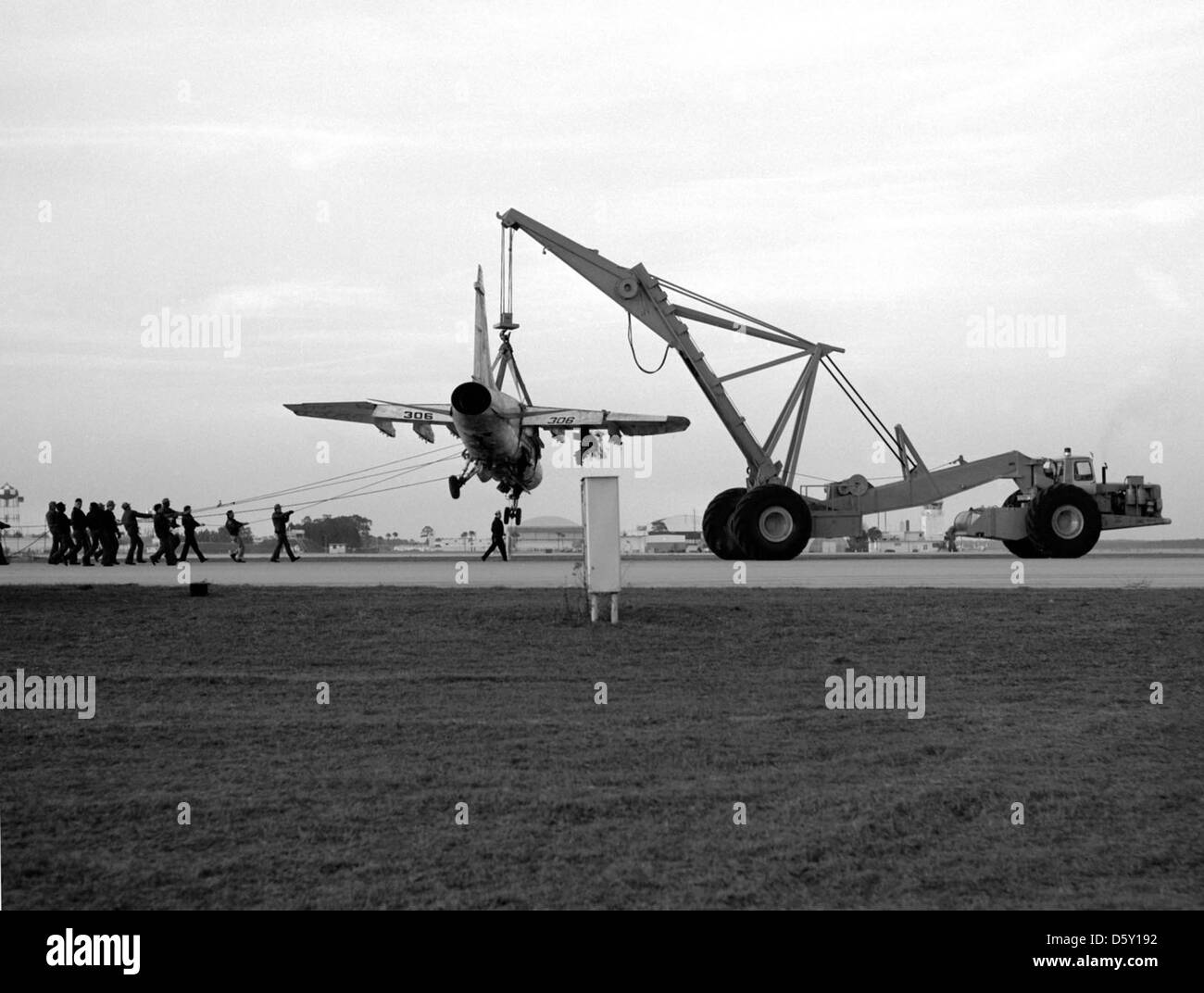 A U.S. Navy aircraft crane is used to hoist an LTV A7E "Corsair II