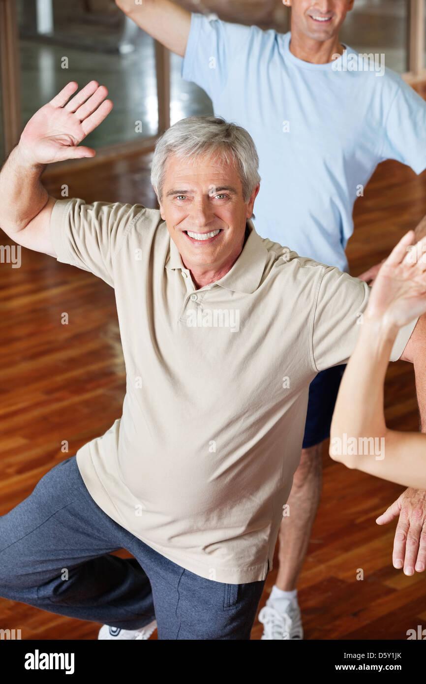 Dancing elderly man in fitness center class Stock Photo
