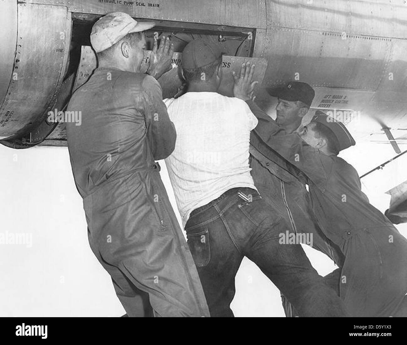 Some times it took some extra hands to close the Boeing B-47 'Stratojet' heavy brake chute door. Stock Photo