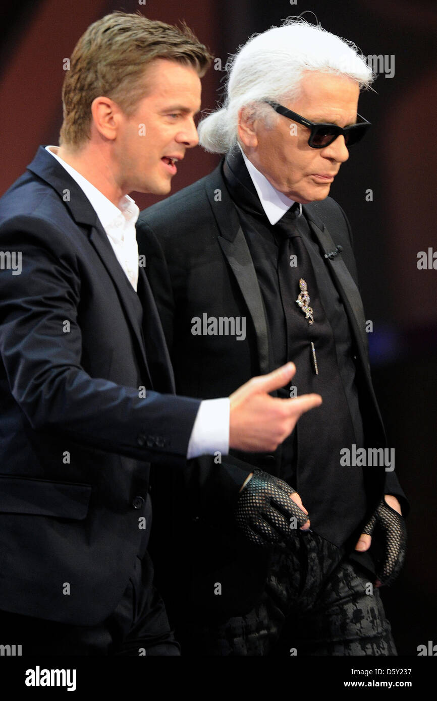 Presenter Markus Lanz (L) welcomes bet sponsor Karl Lagerfeld during