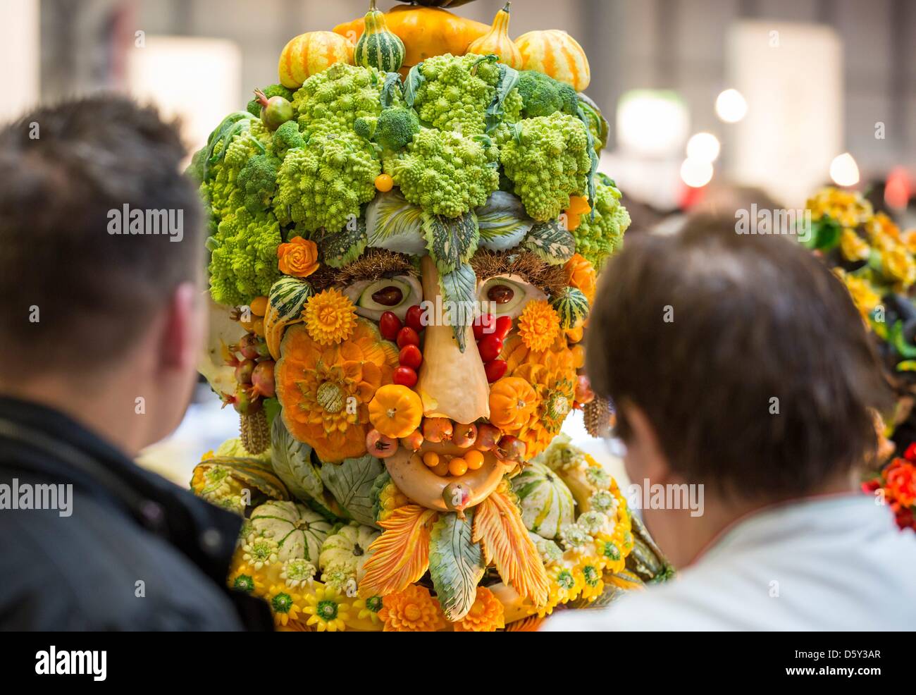 Visitors look at culinary artistic showpiece from the Italian cooks at International Exhibition of Culinary Art in Erfurt, Germany, 09 October 2012. The largest culinary exhibition in the world is drawing gourmet chefs to Erfurt. Creations by professional teams from around 50 countries can be tasted daily. Tomorrow the awards ceremony will take place. Photo: MICHAEL REICHEL Stock Photo