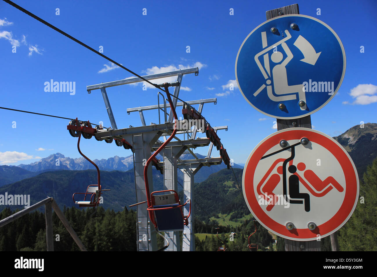 Skilift with chairlift signs, Spanov vrh, Slovenia Stock Photo