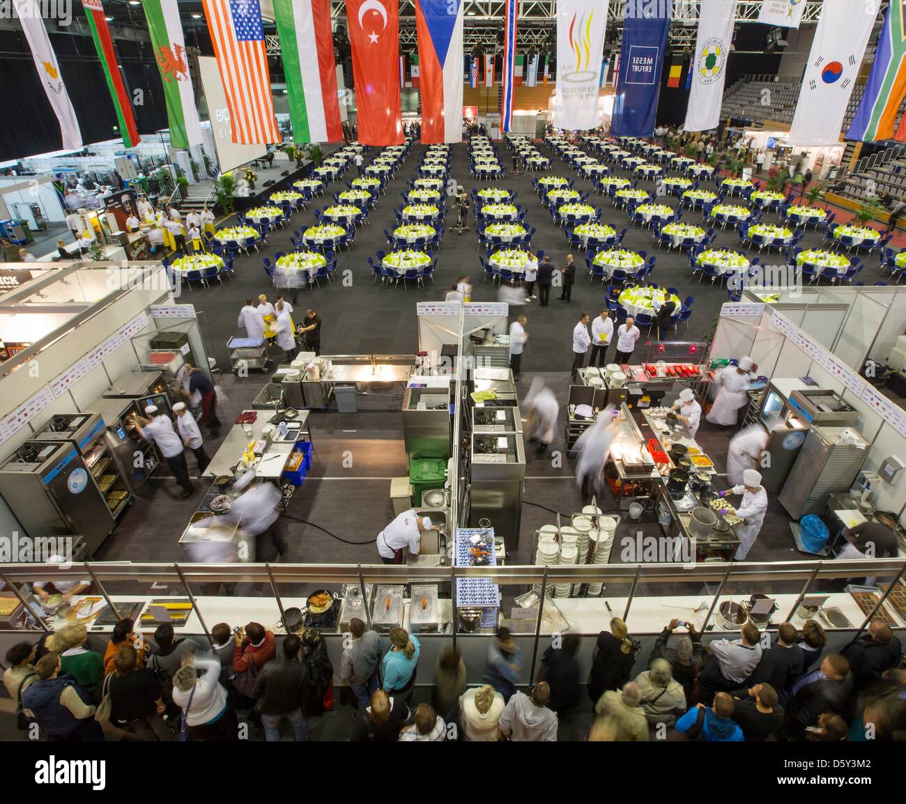 Visitors view chefs at the Culinary Olympics at the fair in Erfurt, Germany, 07 October 2012. The Swedish national chef team won the International Exhibition of Culinary Art in front of Norway and Germany. Photo: MICHAEL REICHEL Stock Photo