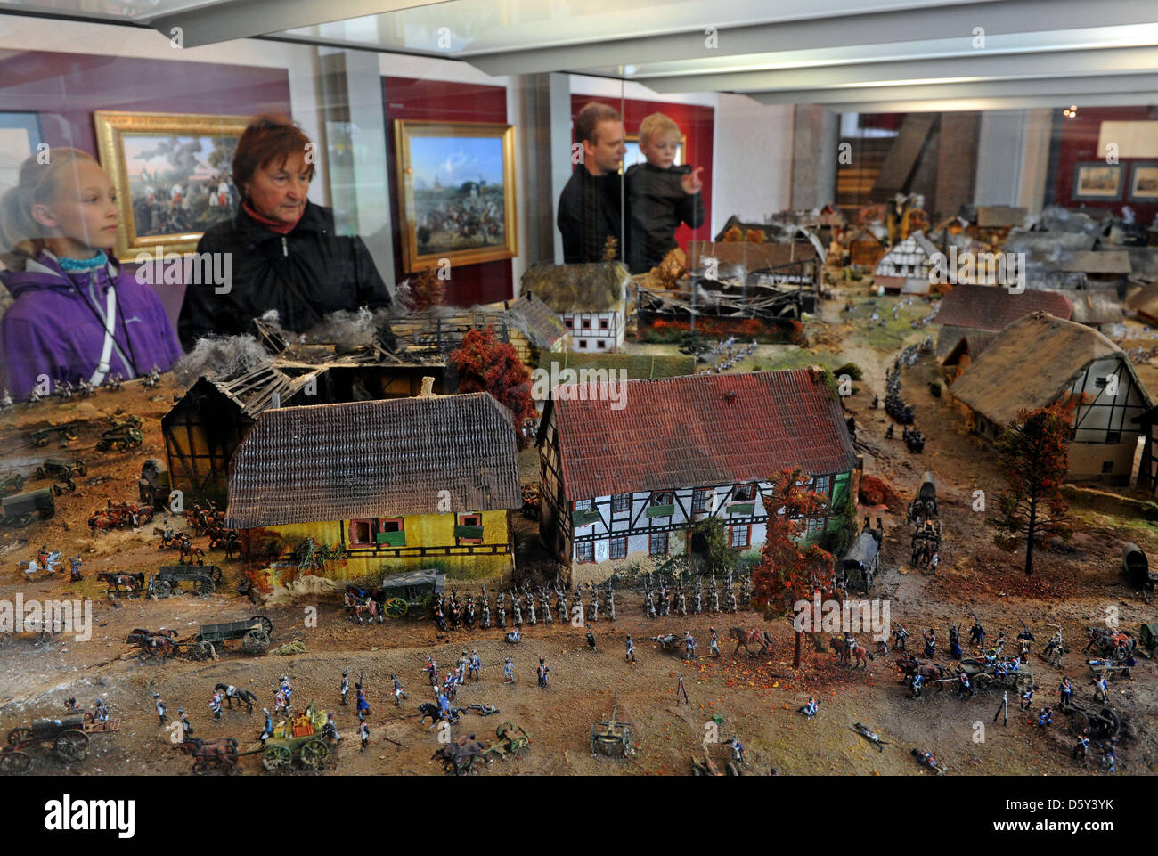 Visitors to the museum at the Memorial to the Battle of Leipzig look at a diorama with a depiction of the battle in Leipzig, Germany, 10 October 2012. The 200th anniversary of the battle is in October 2013. There will be a reinactment of the battle between Napolean's troups and a coalition of Prussia, Russia, Austria and Sweden with a few thousand participants from all over Europe. Stock Photo