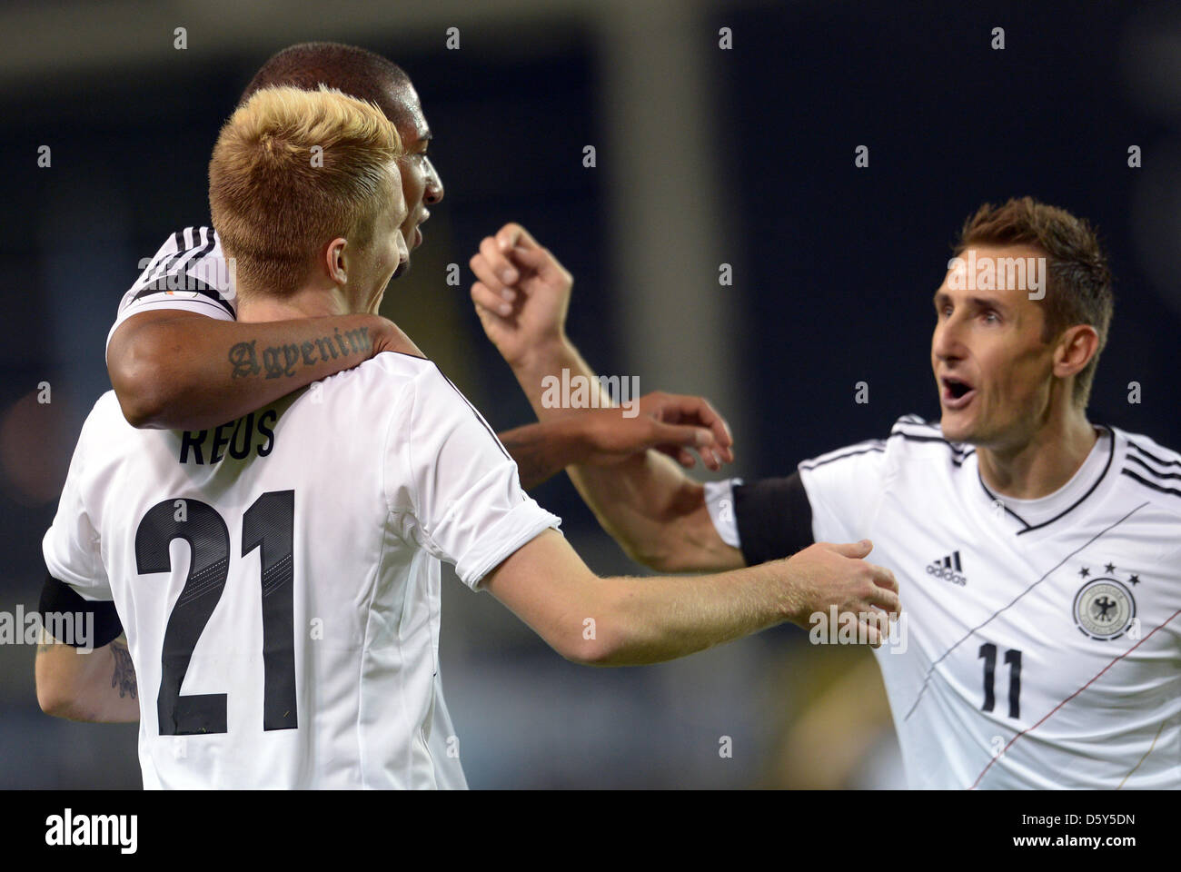 Germany's Marco Reus celebrates with team mates Miroslav Klose (R) and Jerome Boateng (L) after scoring the opening goal 0-1 during the FIFA World Cup 2014 qualifying soccer match between Ireland and Germany at Aviva stadium in Dublin, Ireland, 12 October 2012. Photo: Federico Gambarini/dpa  +++(c) dpa - Bildfunk+++ Stock Photo