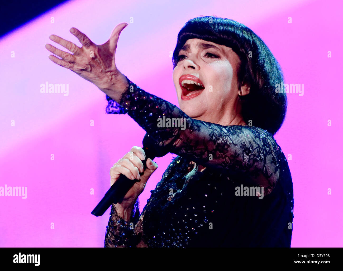 French singer Mireille Mathieu performs at the 'Autumn Festival of Surprises' held in Riese, Germany, 13 October 2012. The show was presented live on German television. Photo: ANDREAS LANDER Stock Photo