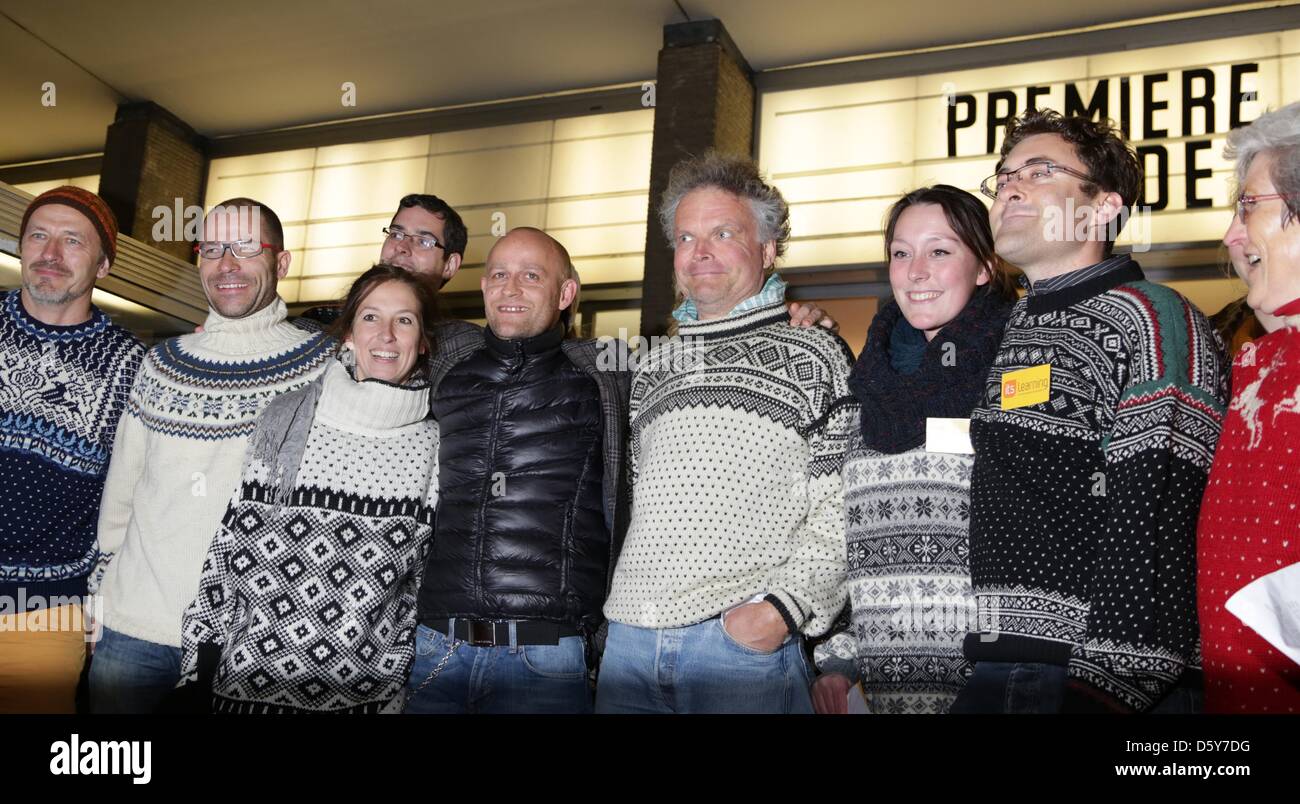Actor Juergen Vogel (5-L) and visitors in typical Norwegian pullovers sing the song 'Take On Me' of the former Norwegian band a-ha during the premiere of the movie 'Gnade' ('Grace') at the International cinema in Berlin, Germany, 15 October 2012. The movie will be aired to German cinemas on 18 October 2012. Photo: Joerg Carstensen Stock Photo
