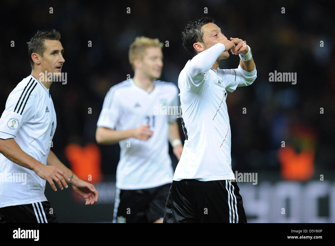 Germany's Mesut Ozil (R) celebrates his 4-0 goal next to Miroslav Klose during the FIFA World Cup 2014 qualifying soccer match between Germany and Sweden at Olympic stadium in Berlin, Germany, 16 October 2012. Photo: Revierfoto Stock Photo
