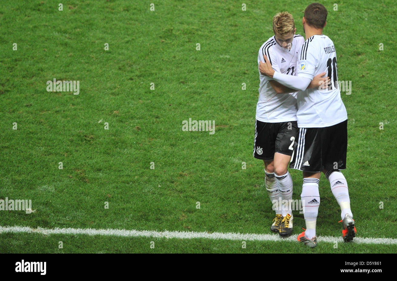 Germany's Lukas Podolski substitutes Marco Reus (L) during the FIFA World Cup 2014 qualifying soccer match between Germany and Sweden at Olympic stadium in Berlin, Germany, 16 October 2012. Photo: Hannibal/dpa Stock Photo