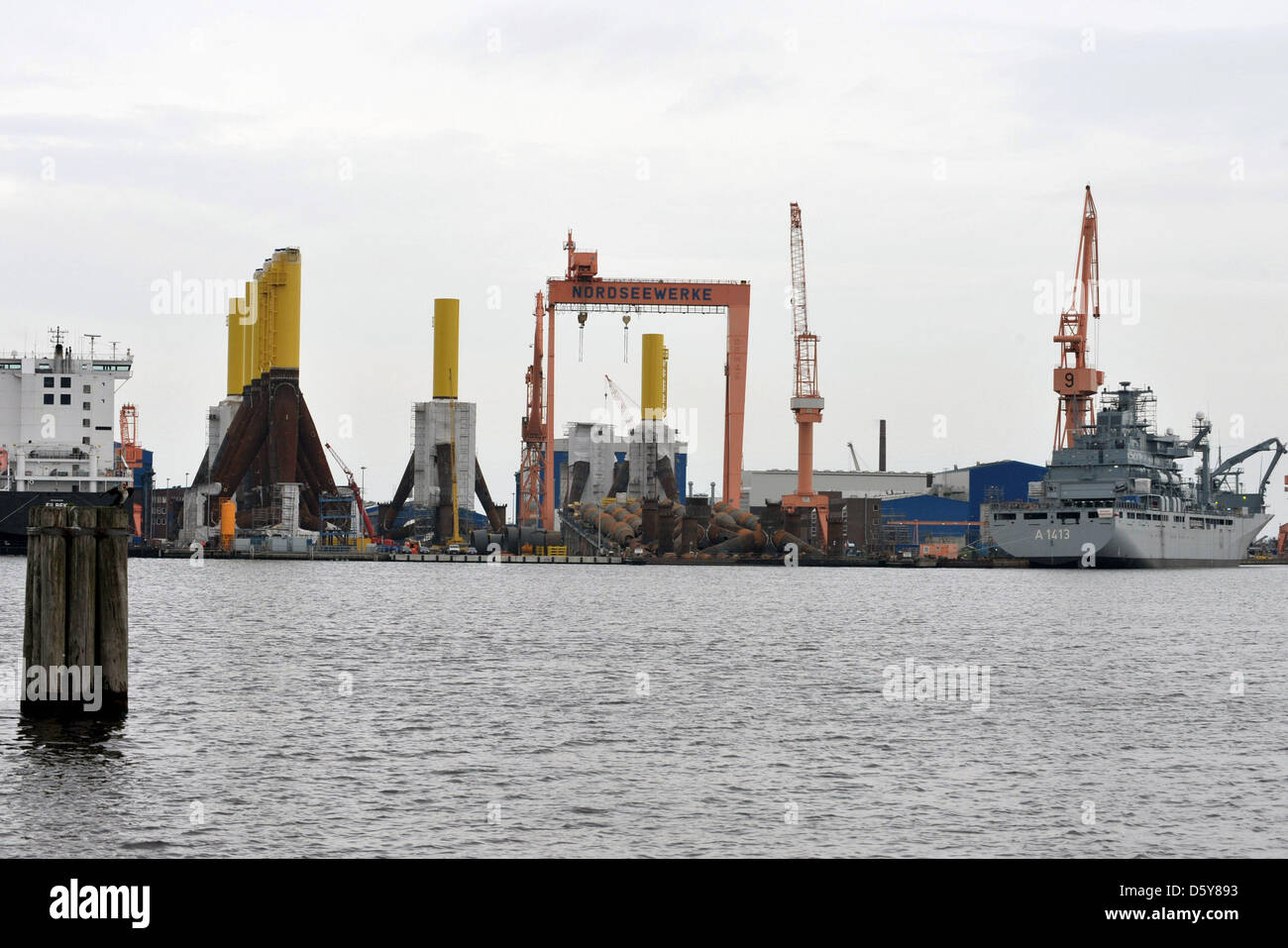 So-called tripods and two ships are pictured at the Siag Nordseewerke shipyard in Emden, Germany, 17 October 2012. These tripods are used as foundations for offshore wind turbines. The struggling offshore supplier with around 700 emplyees has filed for insolvency. The district court Aurich confirmed that such a request had been filed on 17 October 2012. Photo: CARMEN JASPERSEN Stock Photo
