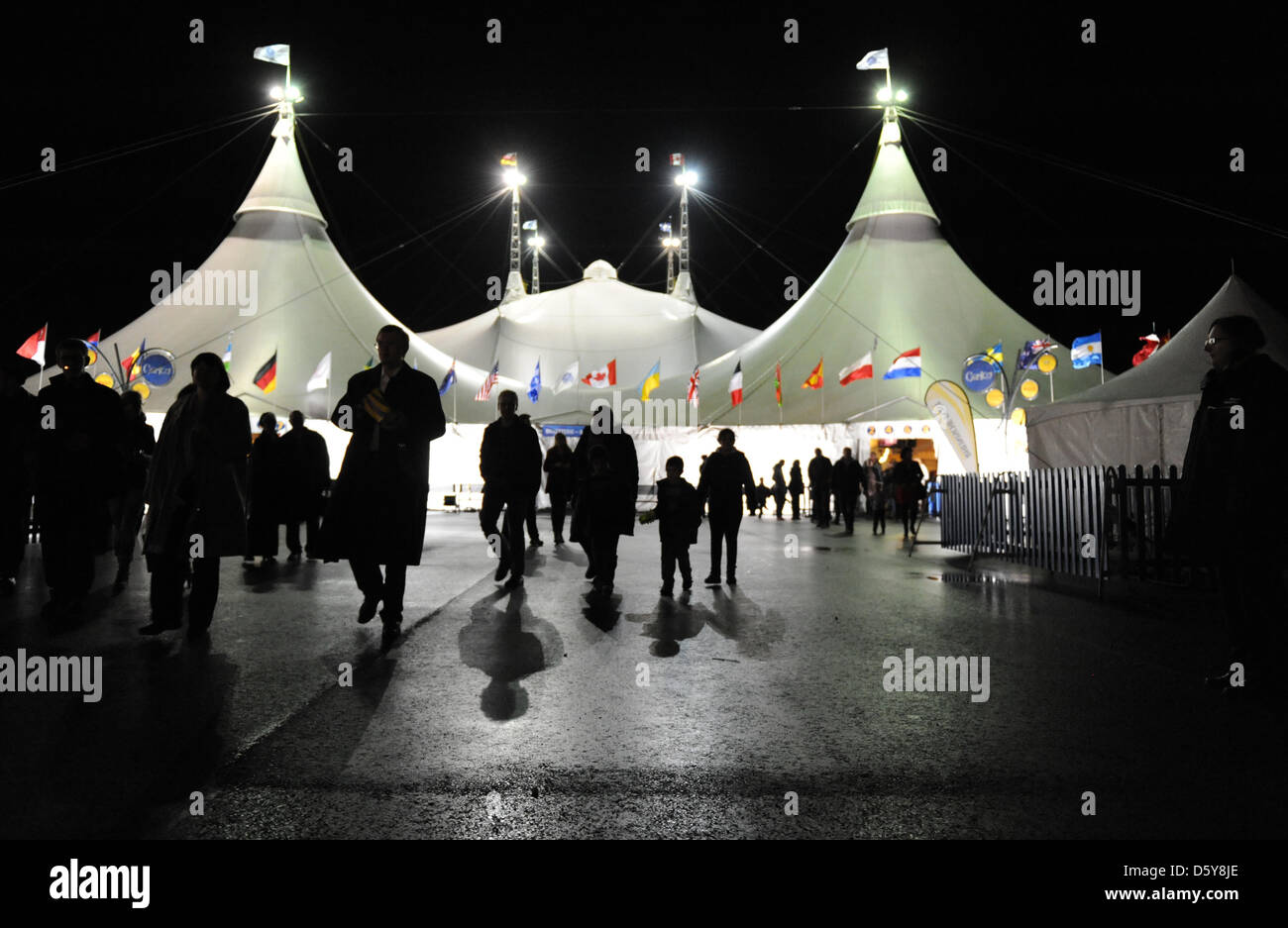People leave the circus tent after rehearsals of the Cirque du Soleil in Duesseldorf, Germany 17 October 2012. The Cirque du Soleil tours with the show 'Corteo' within Germany and the 18 October 2012 is opening night. Photo: Daniel Naupold (ATTENTION: For editorial use only in connection with reports on Cirque du Soleil) Stock Photo