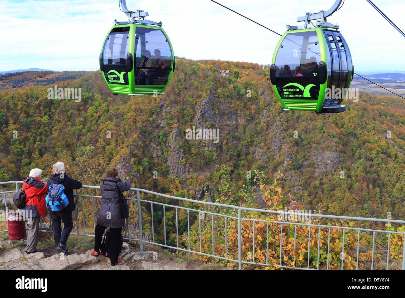 Cabins of the Thale GmbH cable car travel to Witch Dance Square (Hexentanzplatz) in Thale, Germany, 18 October 2012. 10 of the 21 cabins are fitted with panorama windows as well as a glass bottom offering good views. The ride takes from four to eight minutes to climb to a height of 244 meters from valley to mountain station. Photo: Jens Wolf Stock Photo