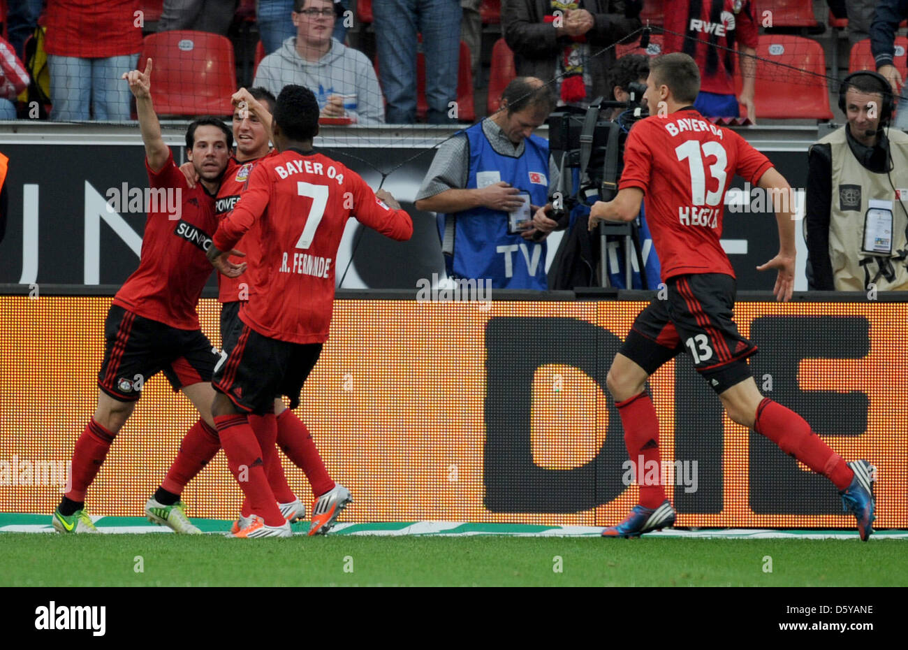 Leverkusen's Gonzalo Castro (L-R), Okan Aydin, Junior Fernandes and Jens Hegeler celebrate during the German Bundesliga match between Bayer Leverkusen and FSV Mainz 05 at BayArena in Leverkusen, Germany, 20 October 2012. The match ended 2-2. Photo: Daniel Naupold  (ATTENTION: EMBARGO CONDITIONS! The DFL permits the further utilisation of up to 15 pictures only (no sequntial picture Stock Photo