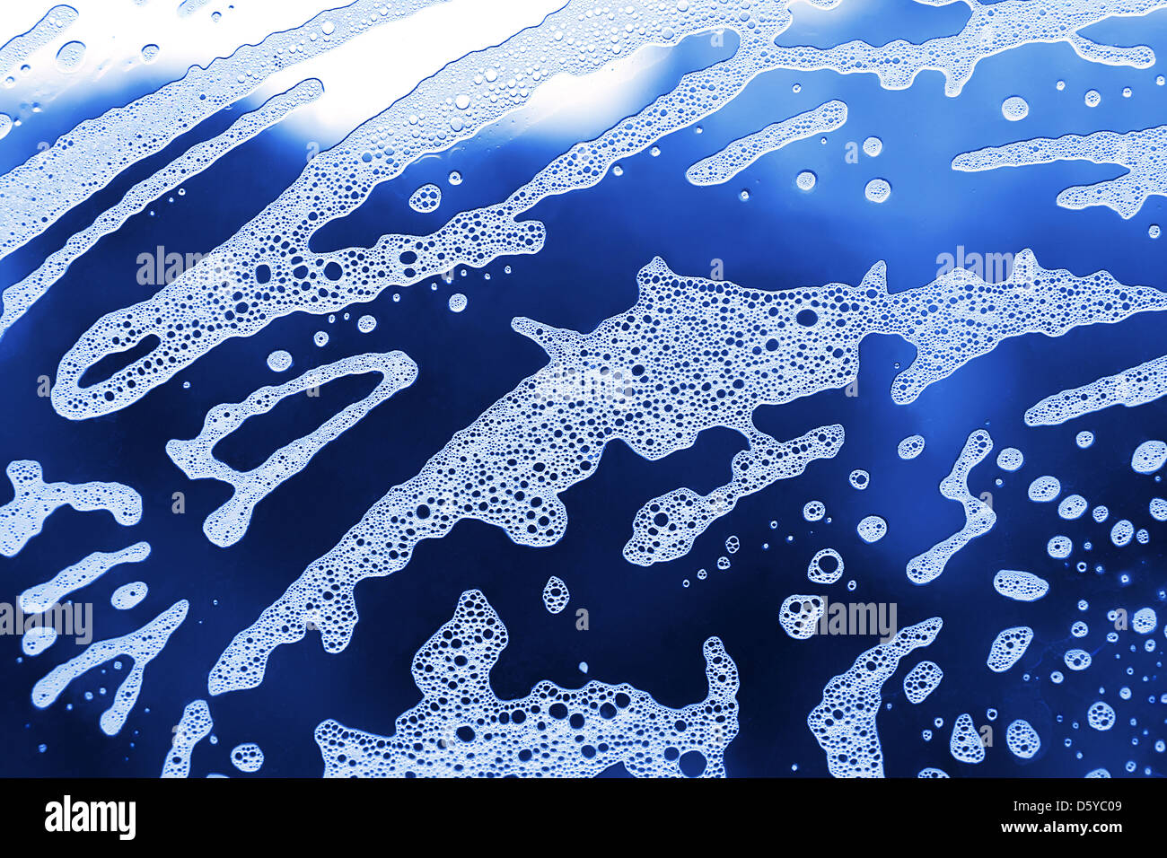 Soap foam on blue hi-res stock photography and images - Alamy