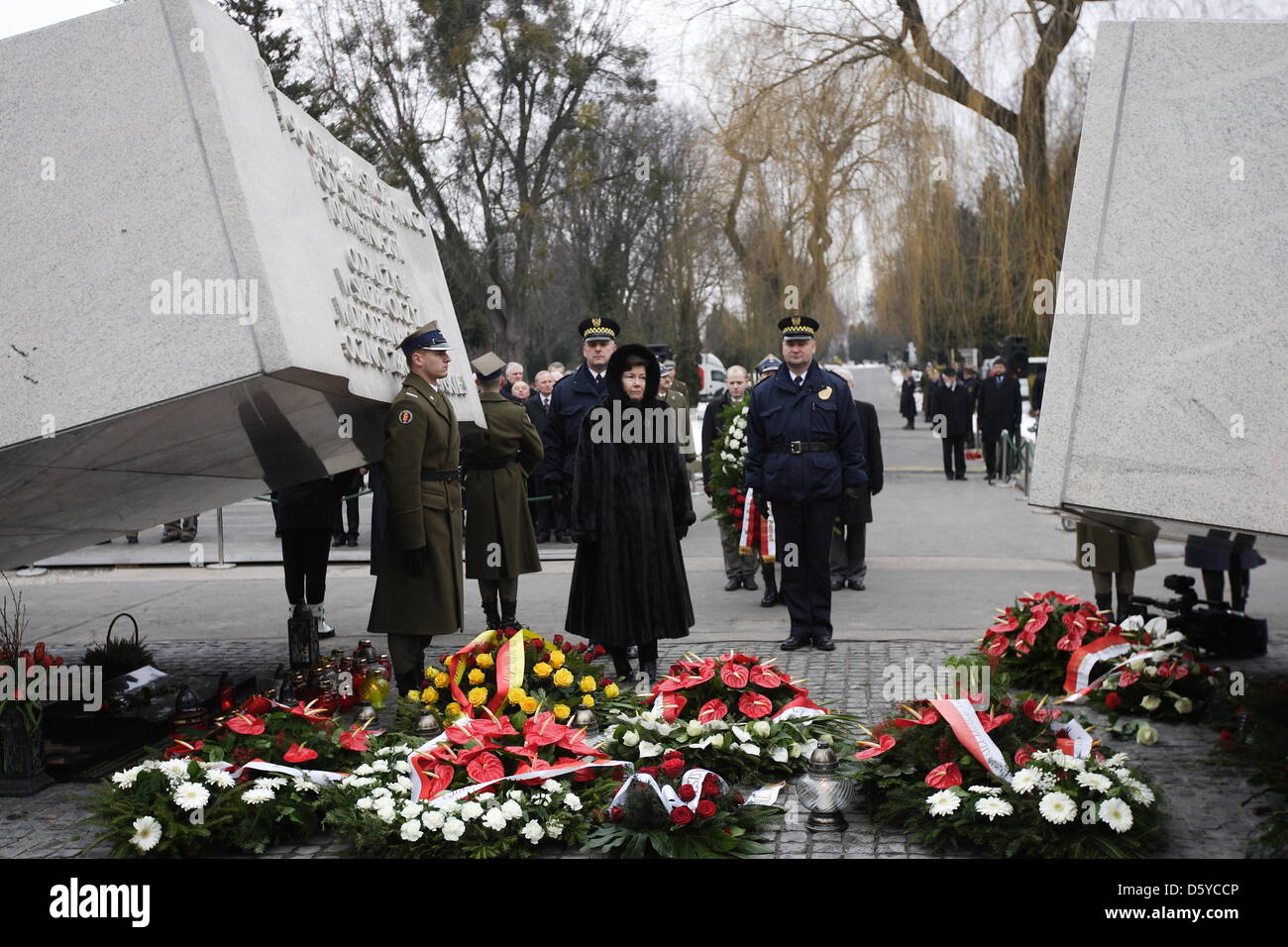 Warsaw, Poland. 10th April 2013. 3rd anniversary of Polish presidental plane crash in Smolensk, Russia in 2010. Government and Parliament members and families lays flowers under the Victims of The Presidental Plane Catastrophe monument in Warsaw at Powazki cemetery. Hanna Gronkiewicz - Waltz Mayor of Warsaw takes part in the ceremony Credit: Michal Fludra / Alamy Live NewsCredit: Michal Fludra /Alamy Live News Stock Photo