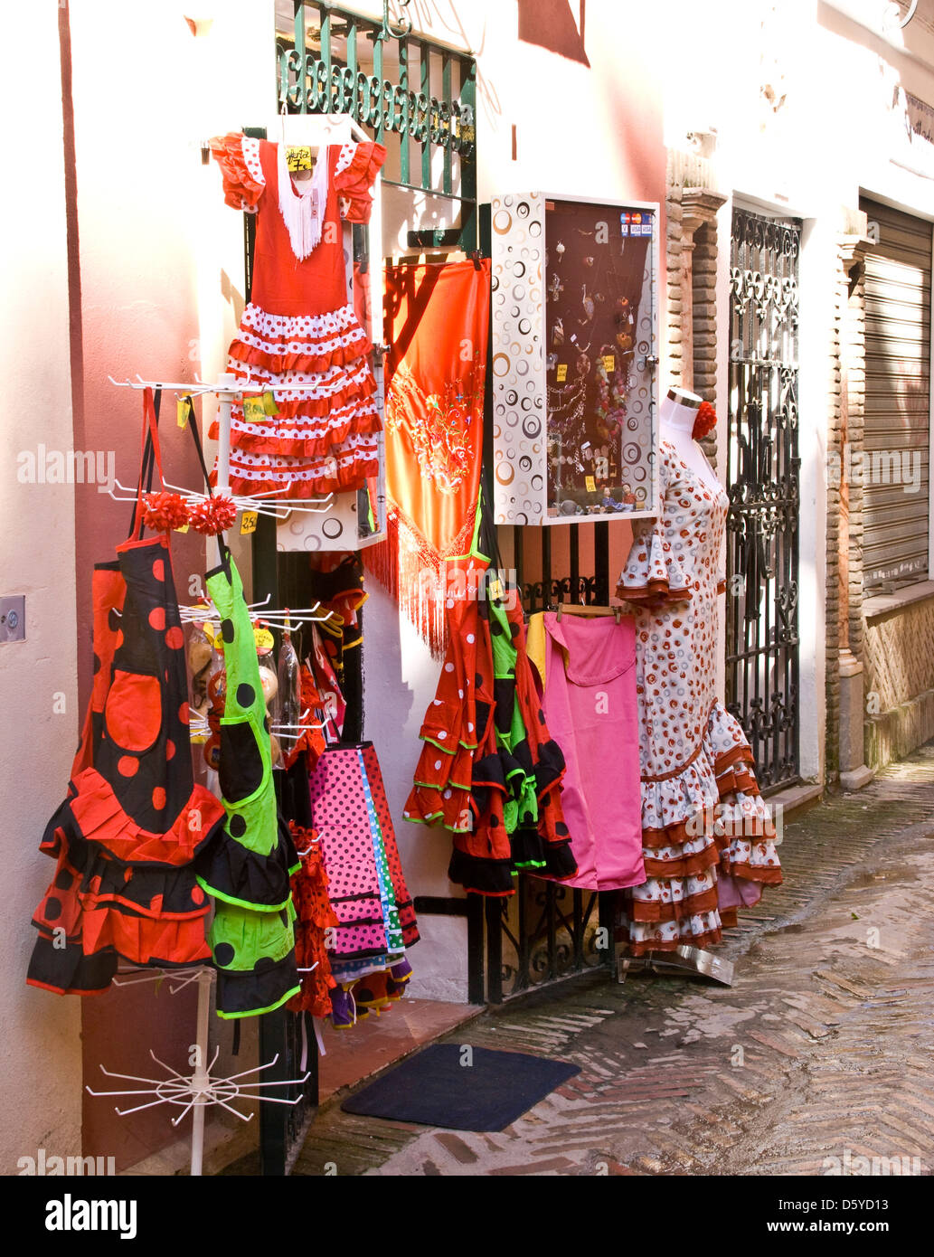 Flamenco dresses on display in a Seville street Andalusia Spain Europe Stock Photo