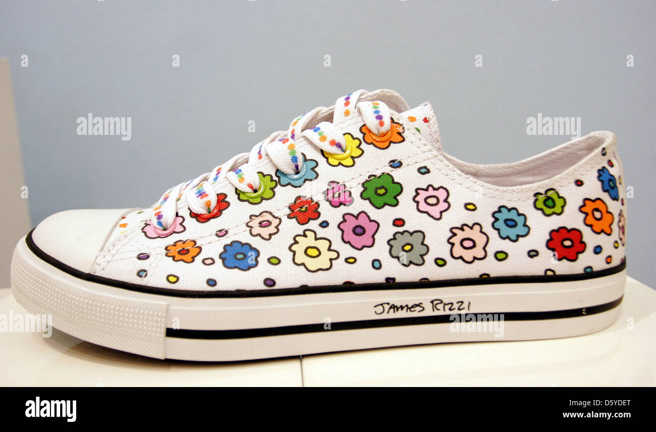 Shoes designed by US American James Rizzi for sports equipment manufacturer  Fila are on display at the art gallery Richter in Berlin, Germany, 29 March  2012. The comprehensive retrospective of the pop-art