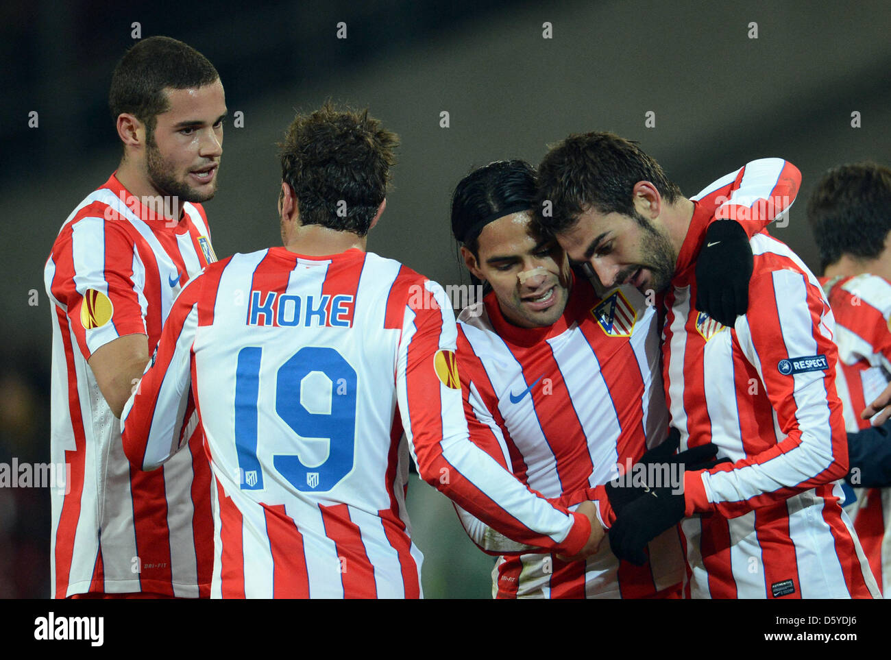 Atletico Madrid's Adrian (R) celebrates with Falcao ((2-R) and Koke (2-L) after scoring the 1-0 during their UEFA Europa League quarter-final first leg soccer match between Hanover 96 and Atletico Madrid at AWD-Arena in Hanover, Germany, 05 April 2012. Photo: Peter Steffen dpa/lni  +++(c) dpa - Bildfunk+++ Stock Photo